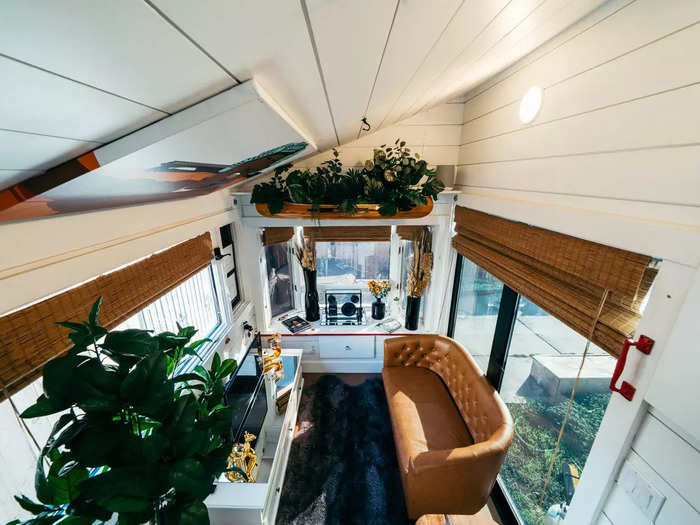 The hanging canoe with plants in it was inspired by one interior stylist Hilton Carter has above his dining table. Troy