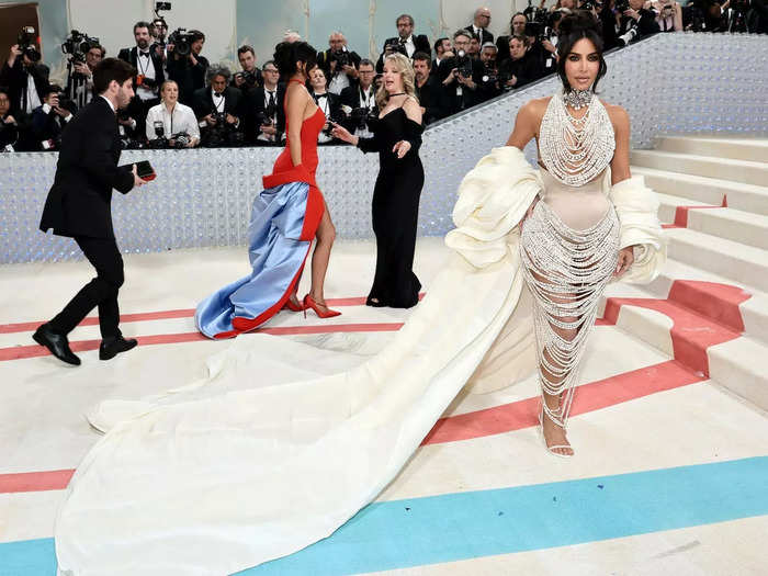 Kim Kardashian wore over 50,000 pearls — and her daughter picked some up as they fell on the way to the Met Gala.