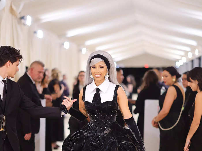 Cardi B wore a black leather gown covered in bold rosettes.