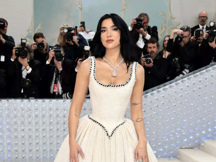 Dua Lipa wore a white Chanel wedding gown with black trim and a huge Tiffany and Co. necklace.