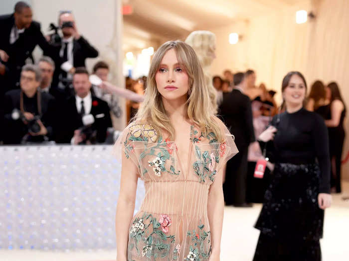 Suki Waterhouse gave effortless glamour in a sheer, nude gown by Fendi that was covered in floral embroidery.