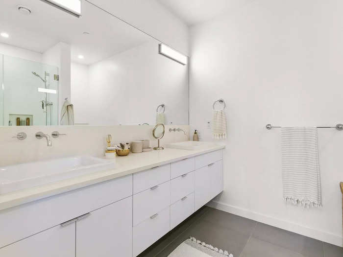 The double-sink vanity also has quartz countertops.