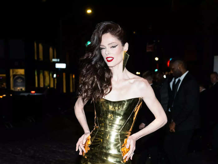 Coco Rocha chose a shiny gold dress for an after-party look.