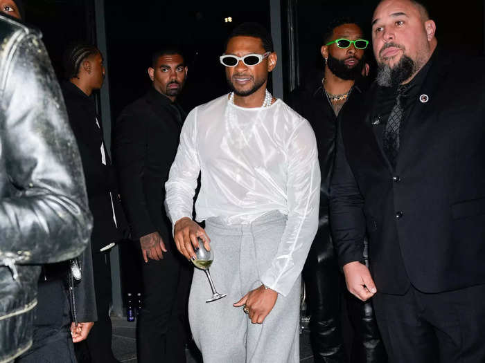 Usher swapped his black suit for a sheer top after the Met Gala.